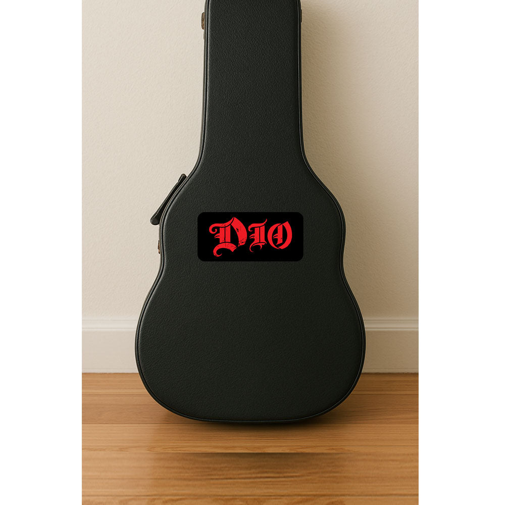 Black guitar case with 'DIO' logo on a wooden floor against a beige wall