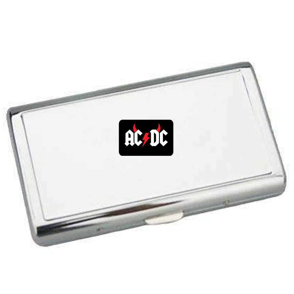 Metallic rectangular object with AC/DC logo on a white background