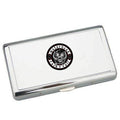Metallic business card holder with a central logo on a white background