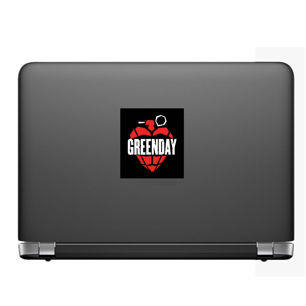 Black laptop with a Greenday sticker on a white background